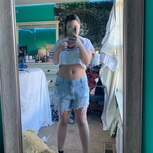 Ripped light blue jean shorts